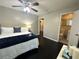Comfortable bedroom suite with a modern bed frame, decorative pillows, and an ensuite bathroom with great features at 1900 Meadow Ln, Decatur, GA 30032