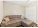 Bedroom area offering a comfortable sofa with chaise and a mirrored sliding closet at 409 Katherine Ln, Woodstock, GA 30189