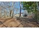 Exterior view of the house, showing the deck and backyard setting at 409 Katherine Ln, Woodstock, GA 30189