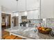 Beautiful kitchen featuring granite countertops, stainless steel appliances, and neutral backsplash at 409 Katherine Ln, Woodstock, GA 30189
