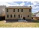Back of house with a small yard, with privacy fence and patio at 120 Park Village Dr, Canton, GA 30114