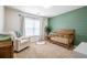 A cozy Bedroom featuring a crib and lots of natural light at 120 Park Village Dr, Canton, GA 30114