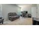 Bedroom featuring two windows, carpet flooring and a brown leather sofa at 120 Park Village Dr, Canton, GA 30114