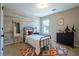 Cozy bedroom with decorative wood wall and playful decor at 120 Park Village Dr, Canton, GA 30114