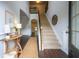 Bright foyer with wood floors, staircase, and natural light creates a welcoming entrance at 120 Park Village Dr, Canton, GA 30114