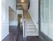 Inviting foyer with hardwood floors and staircase leading to the second floor, open to the living spaces at 120 Park Village Dr, Canton, GA 30114