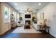 Inviting living room featuring a fireplace, large windows, and hardwood-style floors at 120 Park Village Dr, Canton, GA 30114