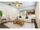 Bright living room features ceiling fan, neutral paint, white sofa, and hardwood-style floors at 120 Park Village Dr, Canton, GA 30114