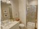 Bathroom featuring modern shower and vanity, accented with decorative art at 14 Lochurst Ln # 153, Roswell, GA 30076