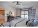 Bright bedroom boasts a walk-in closet and complements white walls with a blue-themed decor at 14 Lochurst Ln # 153, Roswell, GA 30076