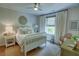 Cozy bedroom with decor, large window, chair and a large area rug at 14 Lochurst Ln # 153, Roswell, GA 30076