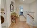 Second floor hallway with hardwood floors, decor, laundry area, and leading to the stairway at 14 Lochurst Ln # 153, Roswell, GA 30076