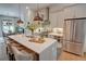 Kitchen with stainless steel appliances and a spacious island with seating at 14 Lochurst Ln # 153, Roswell, GA 30076