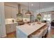 Open concept kitchen showcases a large island and stainless-steel appliances at 14 Lochurst Ln # 153, Roswell, GA 30076