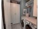 Functional laundry room with modern appliances, shelving and storage at 14 Lochurst Ln # 153, Roswell, GA 30076