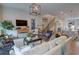 Comfortable living room with hardwood floors, area rug, modern decor and an abundance of natural light at 14 Lochurst Ln # 153, Roswell, GA 30076