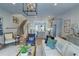 Well-lit living room with hardwood floors, contemporary decor, with kitchen and stairway views at 14 Lochurst Ln # 153, Roswell, GA 30076