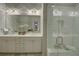 Bright, modern main bathroom featuring double sinks, a tile shower, and elegant lighting at 14 Lochurst Ln # 153, Roswell, GA 30076
