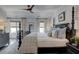 Spacious main bedroom with a four-poster bed, ceiling fan, and large windows at 14 Lochurst Ln # 153, Roswell, GA 30076