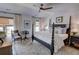 Bright main bedroom with a dark-wood four-poster bed, and an area rug at 14 Lochurst Ln # 153, Roswell, GA 30076