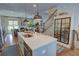 Bright, open-concept living space with kitchen island, hardwood floors, and stylish decor at 14 Lochurst Ln # 15, Roswell, GA 30076