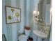 Stylish powder room with striped wallpaper, pedestal sink, and decorative accents at 14 Lochurst Ln # 153, Roswell, GA 30076
