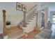 Elegant stairway with hardwood steps, white railings, and natural light at 14 Lochurst Ln # 153, Roswell, GA 30076