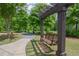 Tranquil wooded area showcases a charming swing bench for relaxing outdoors at 14 Lochurst Ln # 153, Roswell, GA 30076