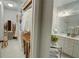 Well-organized walk-in closet leading to the bathroom, featuring ample storage at 14 Lochurst Ln # 153, Roswell, GA 30076