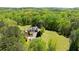 Idyllic aerial view of a home surrounded by lush greenery, offering privacy and scenic beauty at 190 Ward Rd, Ellenwood, GA 30294