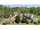 Sprawling property featuring a brick home with a porch, a guest house, and ample parking at 190 Ward Rd, Ellenwood, GA 30294