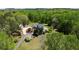 Picturesque estate featuring a brick home, guest house, and lush landscaping at 190 Ward Rd, Ellenwood, GA 30294