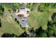 Aerial image of a property featuring a house, detached garage and winding driveway at 190 Ward Rd, Ellenwood, GA 30294