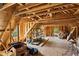 Unfinished attic space with exposed wood beams, offering potential for customization and additional storage at 190 Ward Rd, Ellenwood, GA 30294