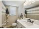 Elegant bathroom with modern fixtures, large mirror, and stylish striped shower curtain at 190 Ward Rd, Ellenwood, GA 30294