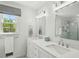 Elegant bathroom featuring double sinks, white cabinetry, and modern lighting at 190 Ward Rd, Ellenwood, GA 30294