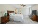 Spacious bedroom featuring neutral colors, a ceiling fan, and plush carpeting at 190 Ward Rd, Ellenwood, GA 30294