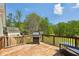 Outdoor deck with grilling area, perfect for entertaining and enjoying the surroundings at 190 Ward Rd, Ellenwood, GA 30294