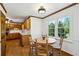 Bright breakfast nook with hardwood floors, natural light, and views into the kitchen at 190 Ward Rd, Ellenwood, GA 30294