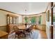 Traditional dining room with wood floors, area rug, bay window, and chandelier lighting at 190 Ward Rd, Ellenwood, GA 30294