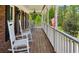 Inviting front porch with rocking chairs, creating a relaxing outdoor space with scenic views at 190 Ward Rd, Ellenwood, GA 30294