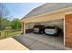 Spacious two-car garage with ample storage space, featuring modern vehicles and a well-lit interior at 190 Ward Rd, Ellenwood, GA 30294