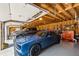 Spacious garage with high ceilings, ideal for car enthusiasts and storage, featuring a blue sports car at 190 Ward Rd, Ellenwood, GA 30294