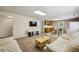 Inviting living room with cozy sofas, TV, and kitchenette offers flexible living and dining space at 190 Ward Rd, Ellenwood, GA 30294