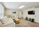 Inviting living room features neutral tones, lots of light, and entertainment setup at 190 Ward Rd, Ellenwood, GA 30294