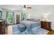 Bright main bedroom with natural light, hardwood floors, and a comfortable king-size bed at 190 Ward Rd, Ellenwood, GA 30294