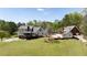 Extensive property featuring a main house, outbuildings, and a spacious green lawn, perfect for country living at 190 Ward Rd, Ellenwood, GA 30294