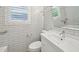 Bright bathroom features white subway tile, a large mirror, and a stylish sink and toilet at 285 Lakemoore Ne Dr # A, Atlanta, GA 30342
