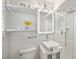 Modern bathroom with an illuminated mirror, a glass-enclosed shower, and white subway tile at 285 Lakemoore Ne Dr # A, Atlanta, GA 30342