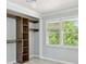 Bedroom closet featuring wood shelves and a sunny window at 285 Lakemoore Ne Dr # A, Atlanta, GA 30342
